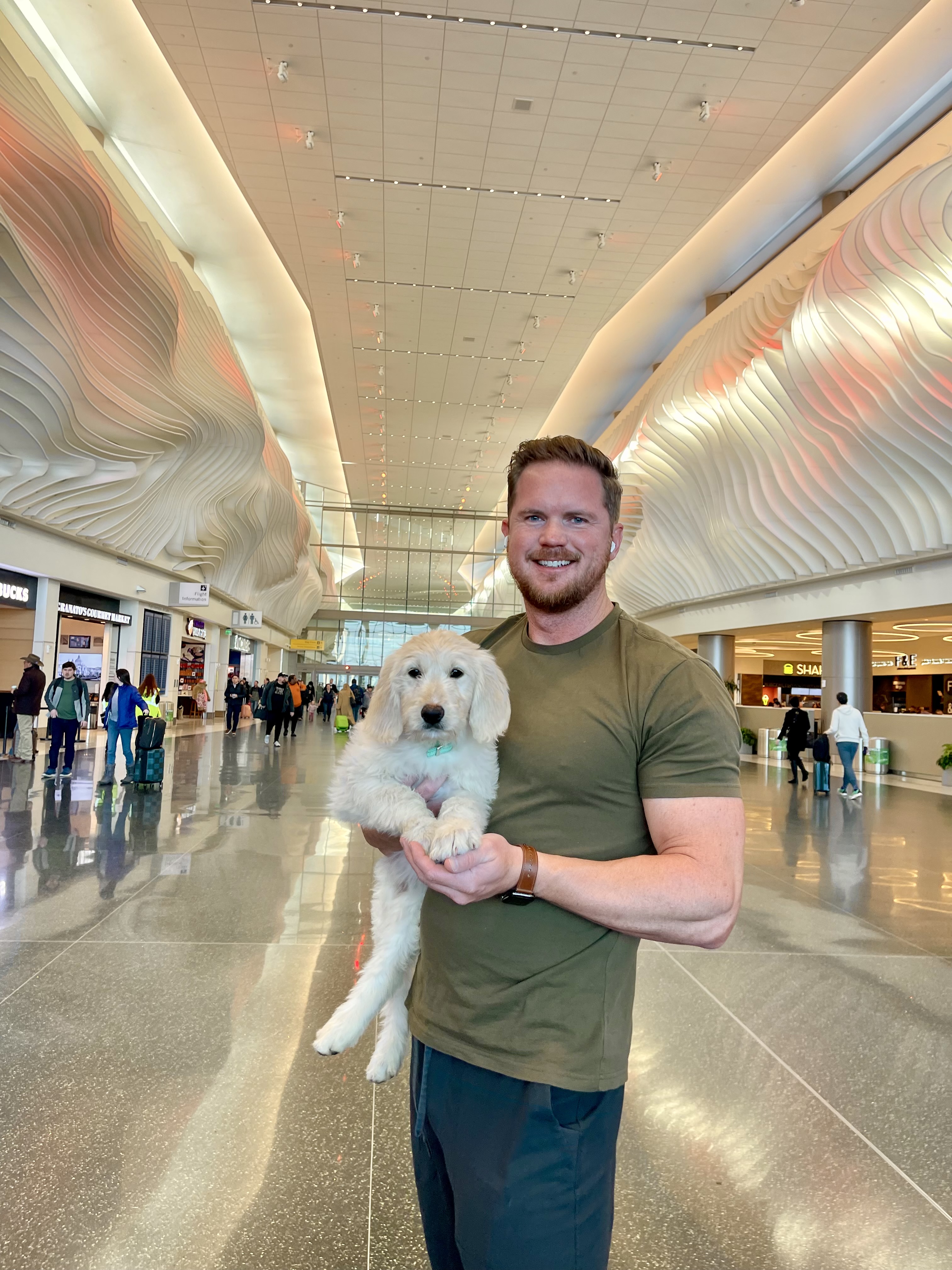 John Armstrong with a pet at the airport